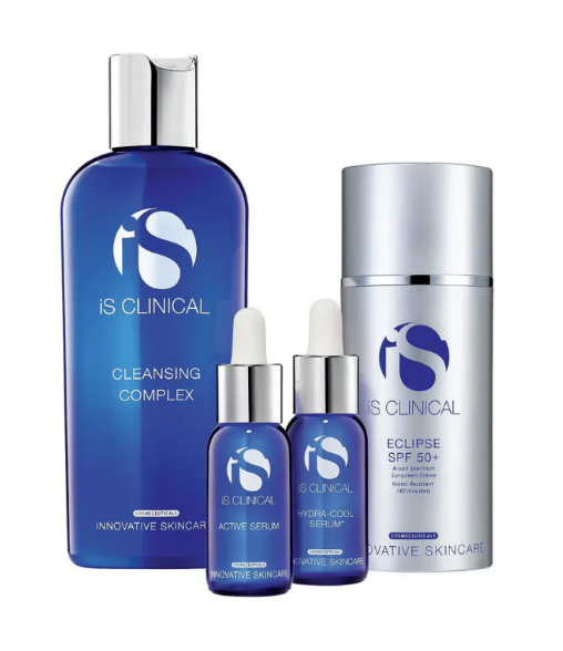 The IS Clinical Pure Clarity Collection is shown, featuring four blue skincare products: Cleansing Complex, Active Serum, Hydra-Cool Serum (both in dropper bottles), and Eclipse SPF 50+ sunscreen in a cylindrical bottle.